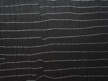 Black genuine leather background, close upの写真素材