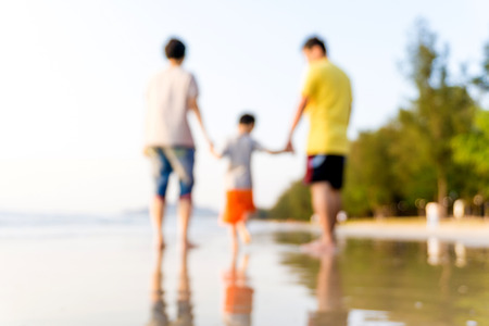 Family having fun on a sandy beach, Happy beautiful familyの写真素材