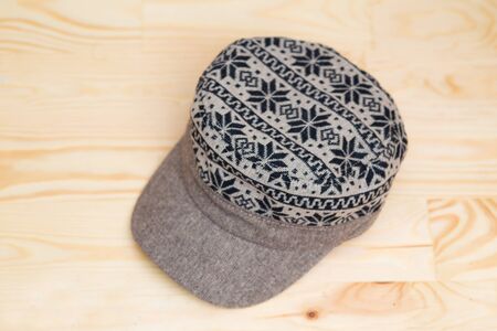 Textile cap onwooden background, Hipster wearの写真素材