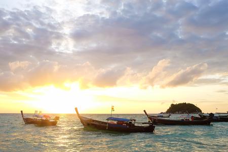 Colorful dawn over the sea with boat. Nature composition.のeditorial素材