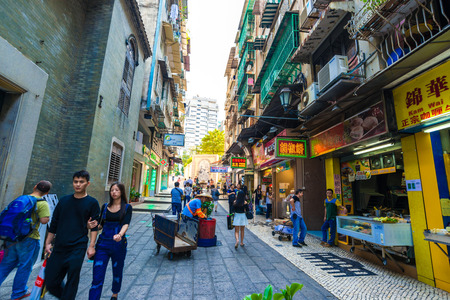 MACAU, CHINA - OCT 22: Visitors visit the famous souvenir street in Macau on October 22, 2015. Chinese tourists are the main resource in Macau tourism industry now.のeditorial素材