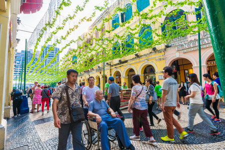 MACAU, CHINA - OCT 22: Visitors visit the famous souvenir street in Macau on October 22, 2015. Chinese tourists are the main resource in Macau tourism industry now.のeditorial素材