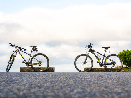 Bicycle on mountain park road outdoor park, Sky backgroundの写真素材