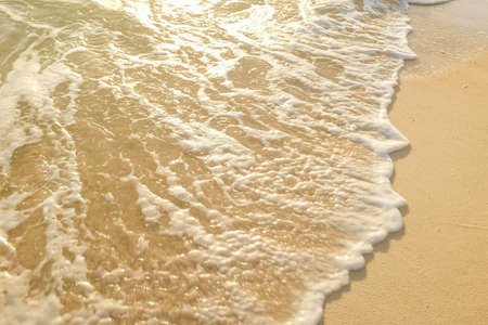 Soft wave of blue ocean on sandy beach. Natural background.の写真素材