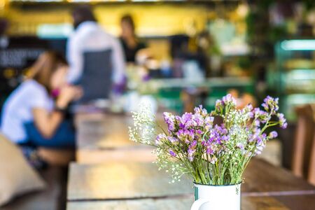 Vintage flowers on wooden in cafe background, Bouquet flower