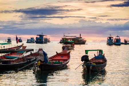 Fishing and transport boat on Koh Tao beach warm light sunset time, Thailand