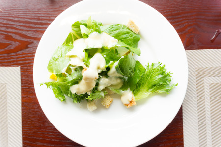 Fresh green salad with spinach lettuce and meat on table, Healthy foodの写真素材