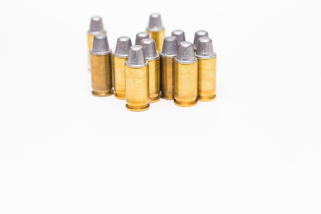 Group of caliber bullets pistols ammo isolated on a white background.