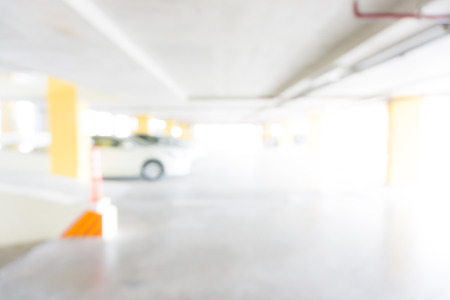 Blurred Underground Parking garage interior with a parked cars light motion blurの写真素材