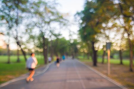 Blurred young people jogging in city park at Bangkok, Thailandの写真素材