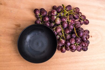Old grapes on a wooden table, Bunch of grapesの写真素材