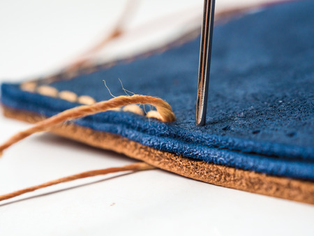 How to make Hand made leather man wallet on wooden backgroundの写真素材