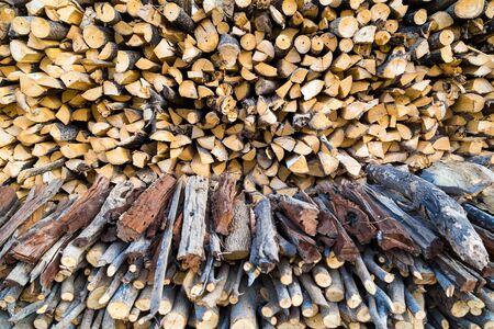Row of fire wood stock for winter near home