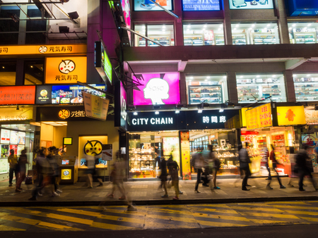 HONG KONG - OCT 22: Tsim Sha Tsui at night on October 2, 2015 in Hong Kong. Tsim Sha Tsui is a major tourist hub in metropolitan Hong Kong, with many high-end shops and restaurantsのeditorial素材