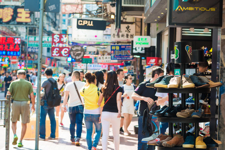 HONG KONG - OCT 24: People shopping at Mong kok on October 24, 2015 in Hong Kong. Mong kok is characterized by a mixture of old and new multi-story buildings, with shops and restaurants at street level.のeditorial素材