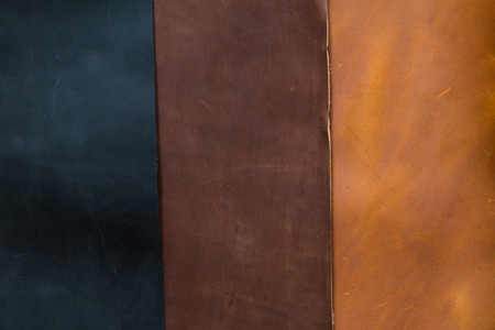 Background of genuine cow oil leather texture, Black brown and light brown