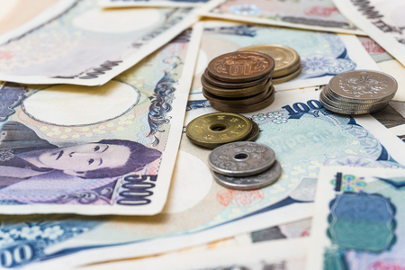 Japan 1000 5000 10000 bank note and coin backgroundの写真素材