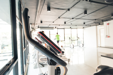 Equipment of sport concept exercise bike in gym, Tool for healthyの写真素材