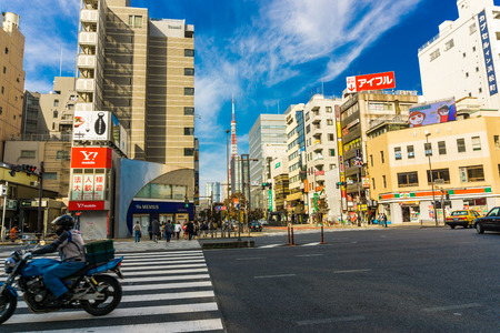 TOKYO, JAPAN - OCTOBER 23, 2016: City life in Minato, Tokyo, Japan. The Greater Tokyo Area is the most populous metropolitan near Tokyo towerのeditorial素材