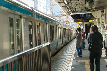 TOKYO, JAPAN - OCTOBER 23: Japanese at Hamamatsucho station on Yamanote line on October 23, 2016. Tokyo, Japan. Tourists from Haneda airport can change train this station to Tokyo or another city in Japan.のeditorial素材