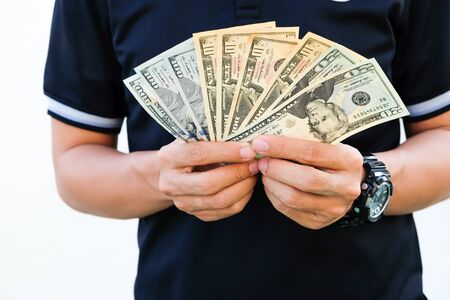 Man hold US dollar currency bill investment isolated on white backgroundの写真素材