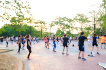 Blurred group of aerobic dancing in park, Fitness at park