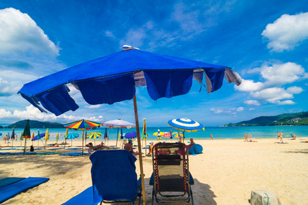 Beach chair summer on island vacation holiday relax in the sun with umbrella. Idyllic travel background.のeditorial素材