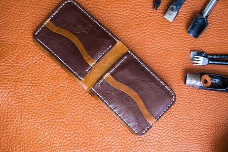 Leather background of wallet production tool top viewの写真素材