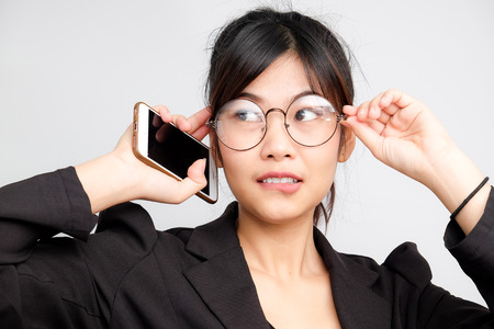 Business asian glasses women with cellphone on white background