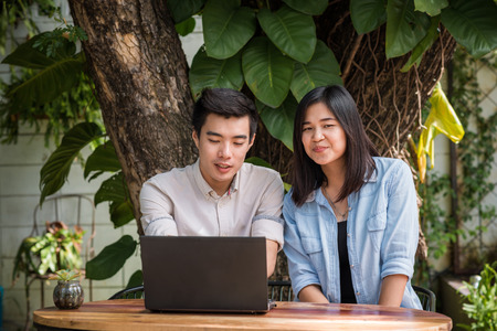 Two young business having a successful co-working at vintage restaurant, Couple in cafeの写真素材