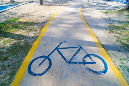 Bicycle road sign symbol to indicate the road for bicycles lane on beachの写真素材