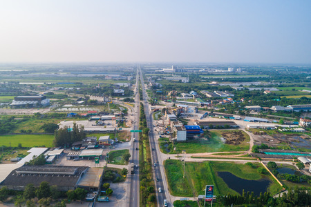 Aerial vew of rural road with car and gree tree into th west region of Thailand, Transport and travelのeditorial素材