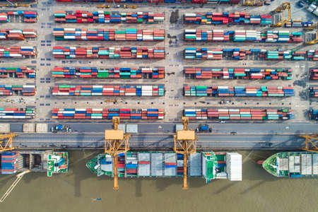 Container ship in import export and business logistic by crane look down view,Trade Port shipping cargo to harbor aerial viewのeditorial素材