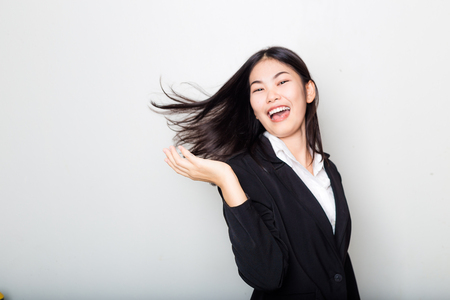 Portrait of young asian business with strong healthy long hair on white backgroundの写真素材