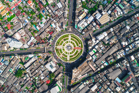 Roundabout junction road traffic car aroud by building beautiful streetの写真素材