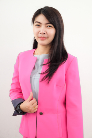 Business asian women wear pink suit standing isolated on white backgroundの写真素材
