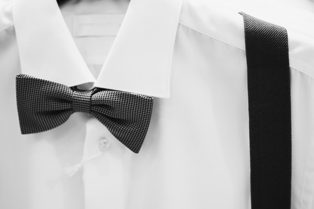 White shirt with dark bowtie in shopの写真素材