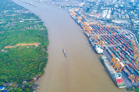 Container ship in shipyard with crane riverside logistic industryのeditorial素材