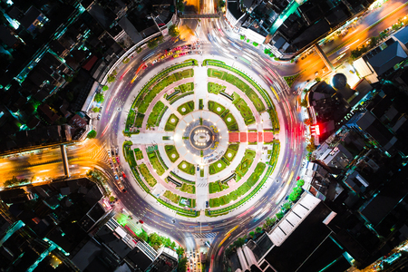 Circle junction traffic road with car light movement aerial viewのeditorial素材