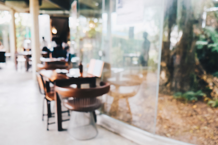 Blurred art wood cafe with chair and table food and drink backgroundの写真素材