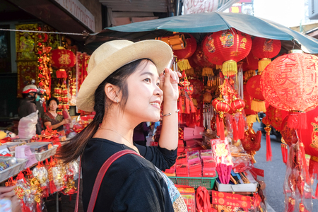 Young asian women backpack traveller stand in Yaowarad city of chinese, Thailandのeditorial素材