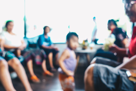 Abstract defocused blurred people backgroun in restaurant with bokehの写真素材