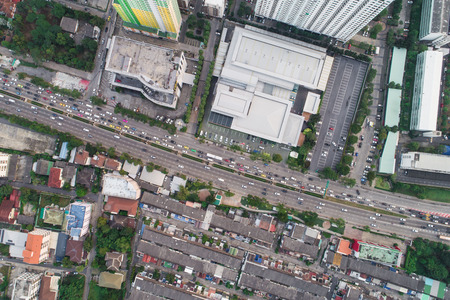 Top view aerial view of modern condominium building with house and flat and city road