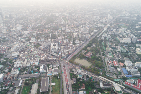 Top view aerial view of modern condominium building with house and flat and city roadの写真素材