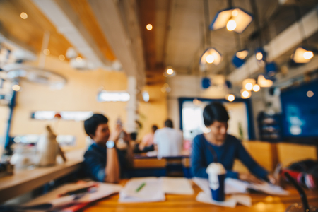 Blurred people co-working space in coffee shop business backgroundの写真素材