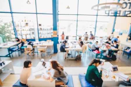 Blurred people co-working space in coffee shop business backgroundの写真素材