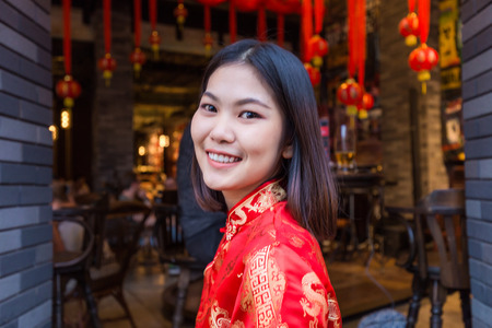 Cheerful smiling asian women in Chinese New Year festival on Yaowarat road, Bangkok Thailandの写真素材