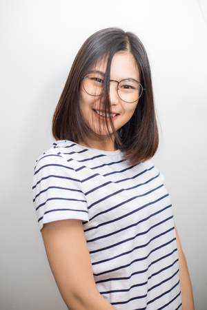 Asian glasses attractive women smiling on white background, Women with eye wearの写真素材