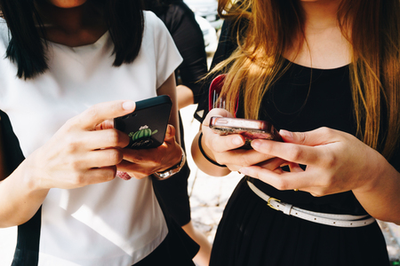 Group of business official women use smartphone outdoor, Technology addictionの写真素材