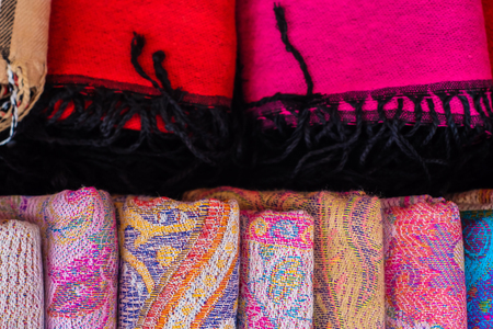 Tradition scarf handmade colorful cotton texture in souvenir shop close upの写真素材